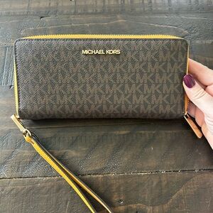 Michael Kors Brown Monogram Zip-Around Wristlet with Yellow Trim